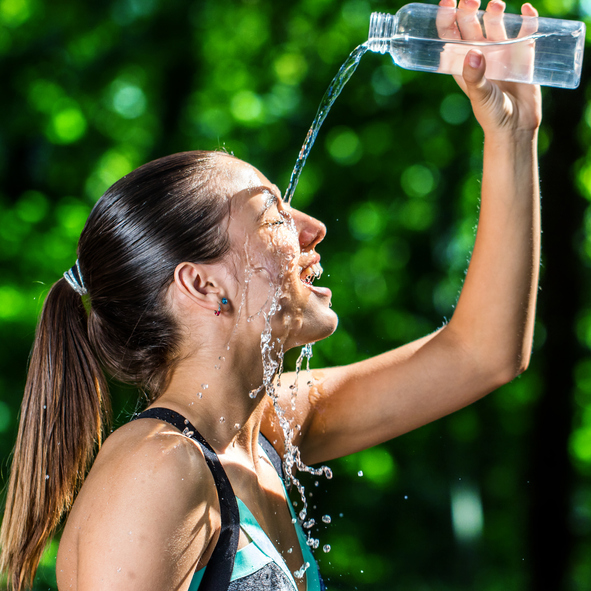 athlete-pouring-cold-water-on-face-after-jog-vitality-magazine